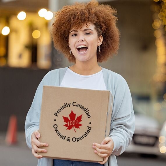 Happy woman holding a package with Proudly Canadian badge